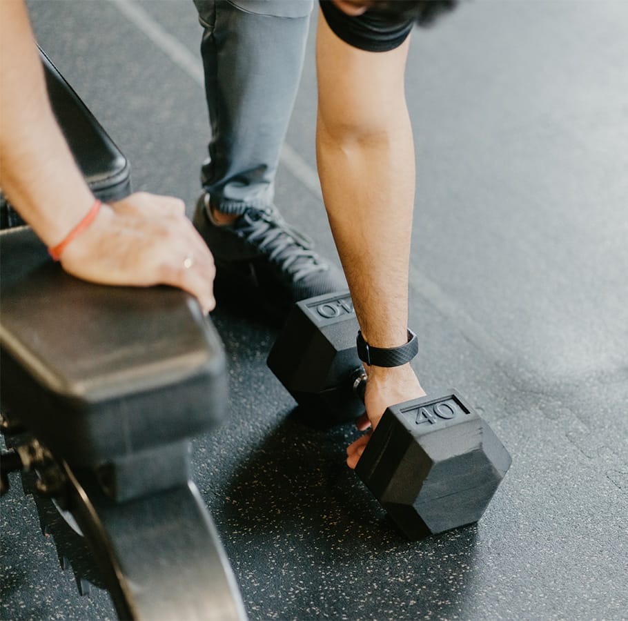 man working out with dumbells