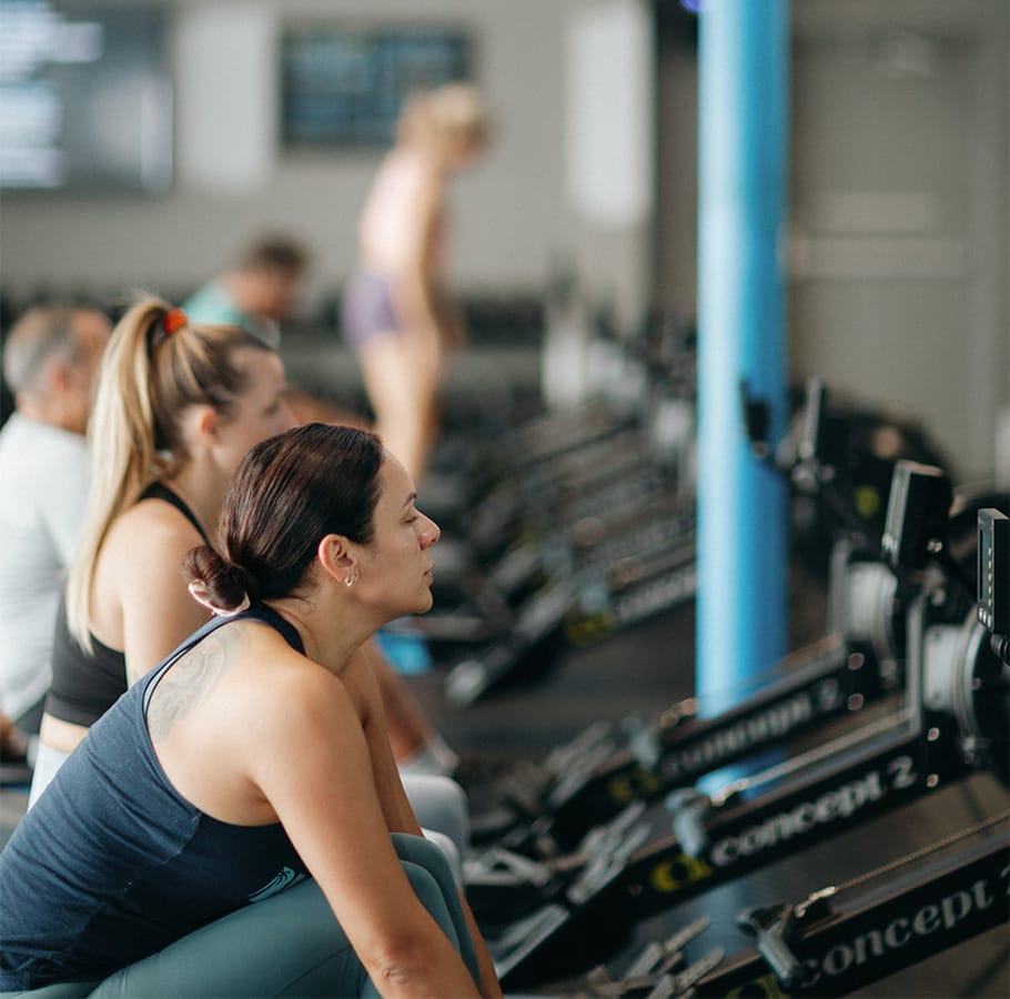 people rowing training together at the gym